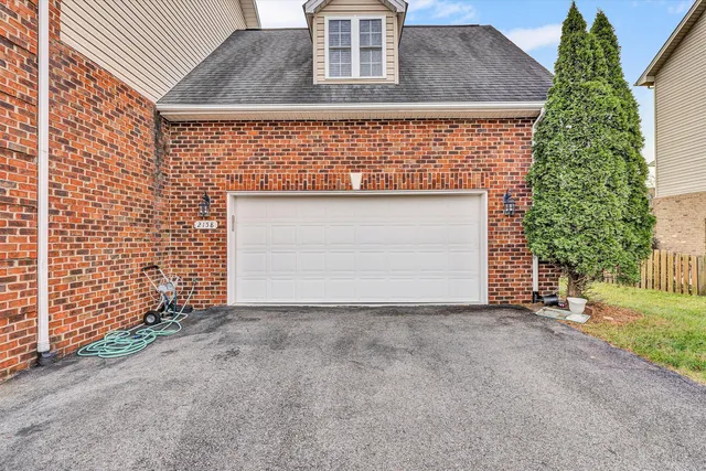 a living room with furniture a fireplace and wooden floor