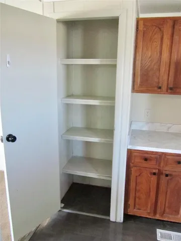 a storage room with wooden floor