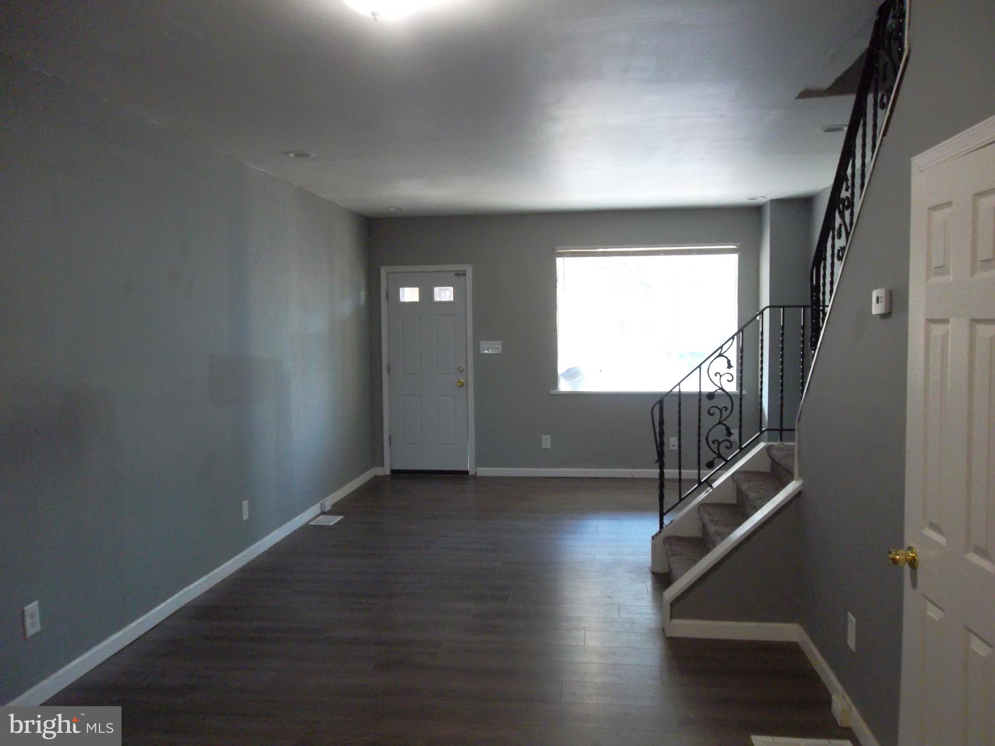5037 Griscom Street Philadelphia, PA 19124 - Photo 2 of 6 Living Room & Dining Area