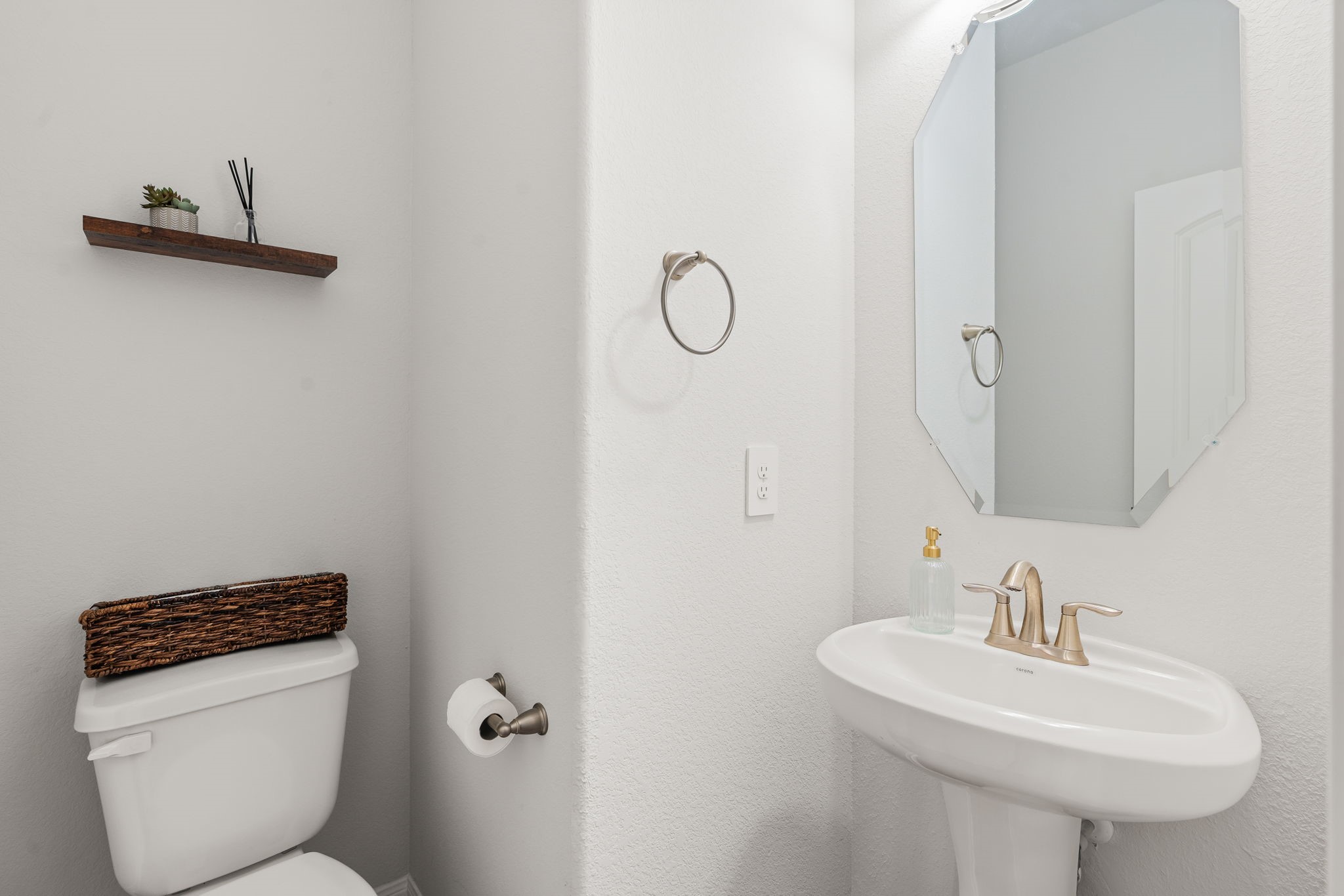 16680 Rockwall Street Conroe, TX 77303 - Photo 16 of 38 Half bath down the hallway from the living room towards the laundry and garage.