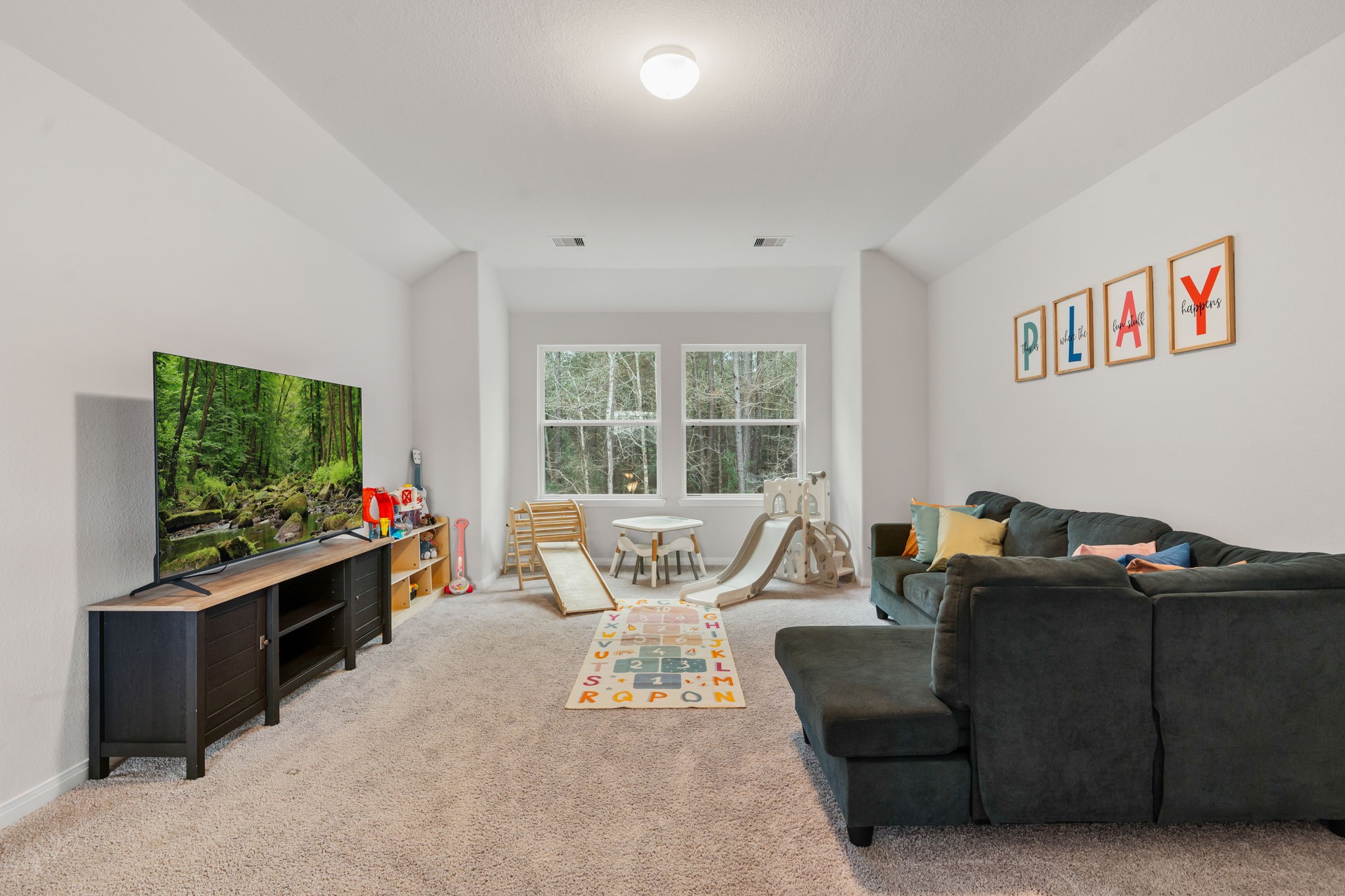 16680 Rockwall Street Conroe, TX 77303 - Photo 22 of 38 This upstairs game room offers the prefect spot for your kids to have their own play or entertainment area.