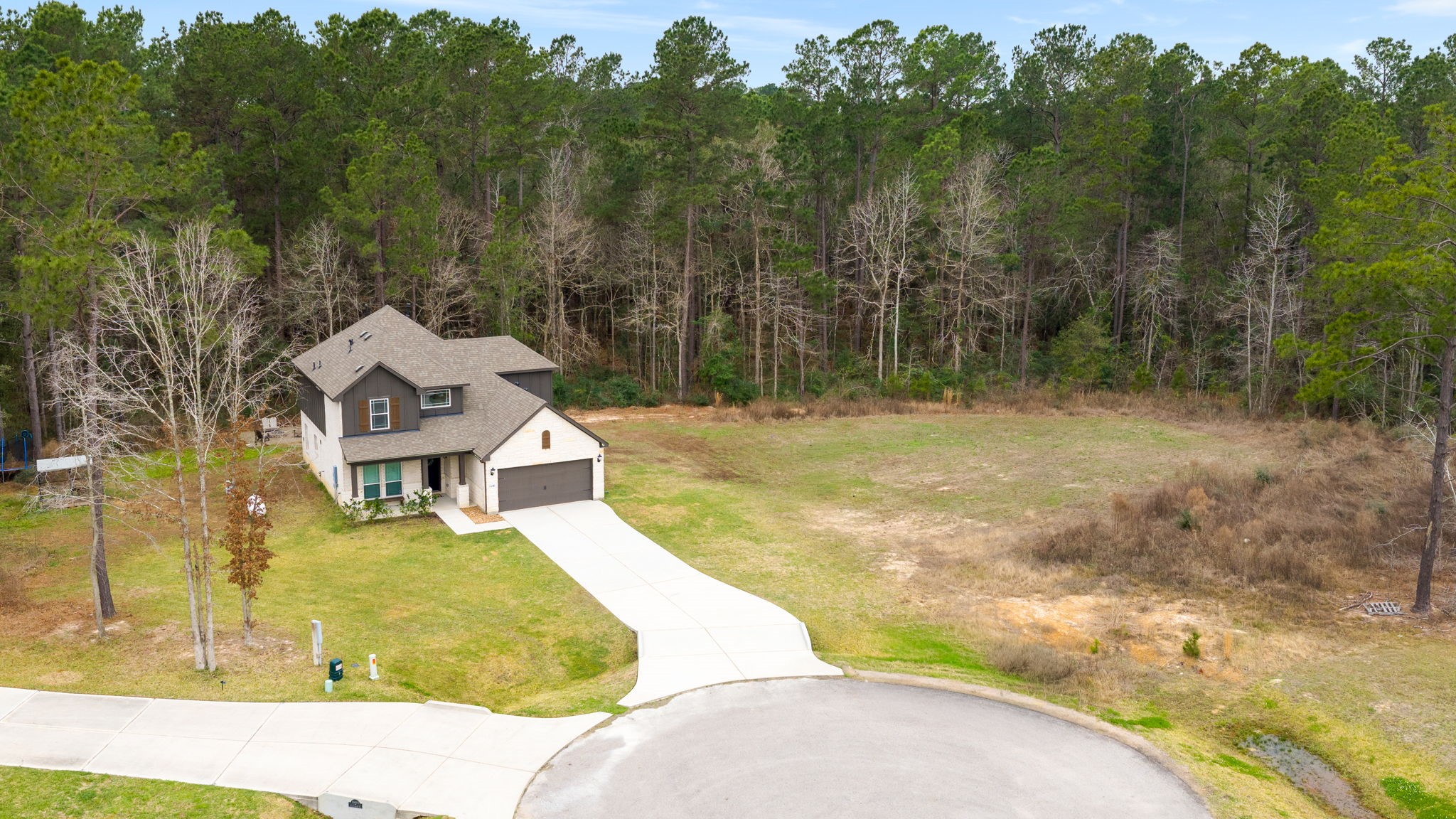 16680 Rockwall Street Conroe, TX 77303 - Photo 33 of 38 Sitting on just shy of an acre, this lot has plenty of space for you. Build your dream shop, store your RV, camper etc.