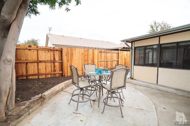 169 Ripley Street Camarillo, CA 93010 - Photo 16 of 17 a patio with yard glass top table and chairs
