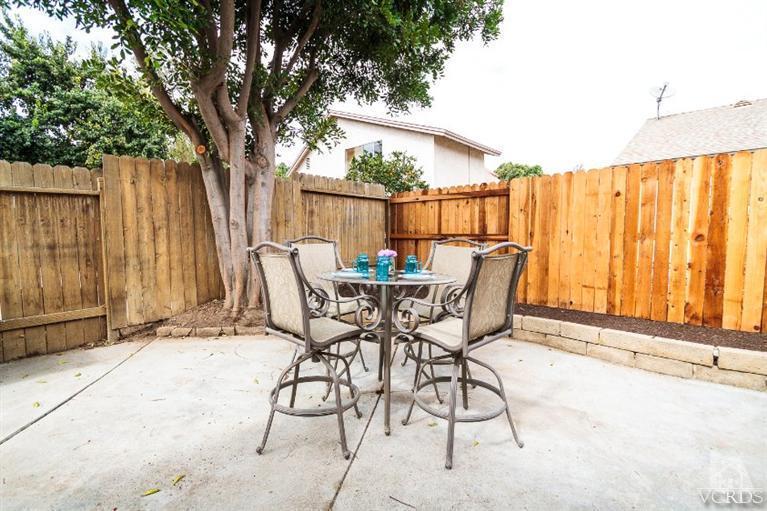 169 Ripley Street Camarillo, CA 93010 - Photo 17 of 17 a patio with table and chairs and potted plants