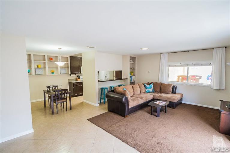 169 Ripley Street Camarillo, CA 93010 - Photo 3 of 17 a living room with furniture and a dining table with kitchen view
