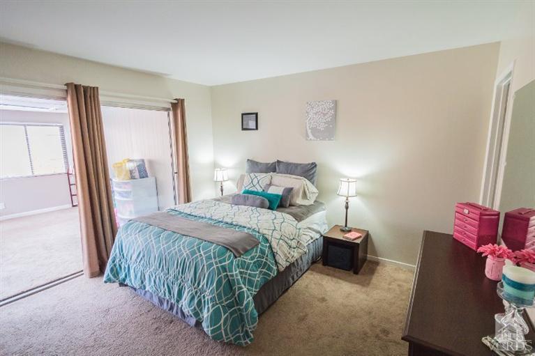 169 Ripley Street Camarillo, CA 93010 - Photo 7 of 17 a bedroom with a bed and a mirror