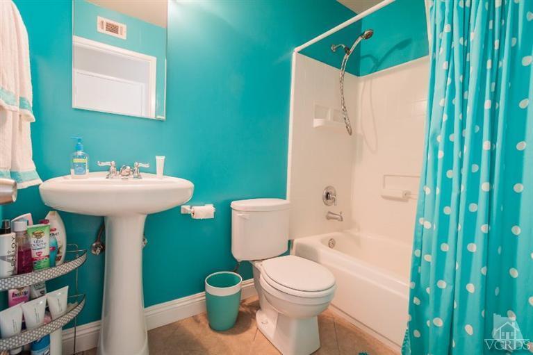 169 Ripley Street Camarillo, CA 93010 - Photo 10 of 17 a bathroom with a sink mirror and toilet