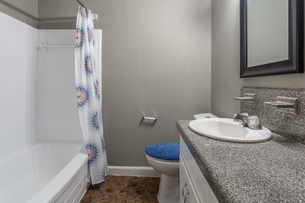 1305 Memorial Drive, Unit 6 Baytown, TX 77520 - Photo 13 of 19 a bathroom with a sink toilet and shower