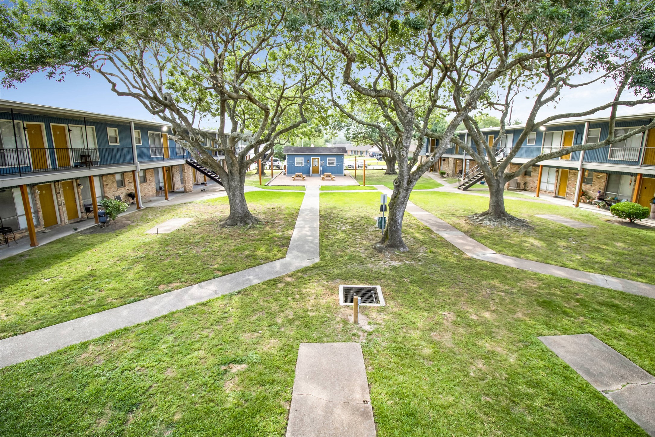 1305 Memorial Drive, Unit 6 Baytown, TX 77520 - Photo 5 of 19 a view of yard with swimming pool and trees