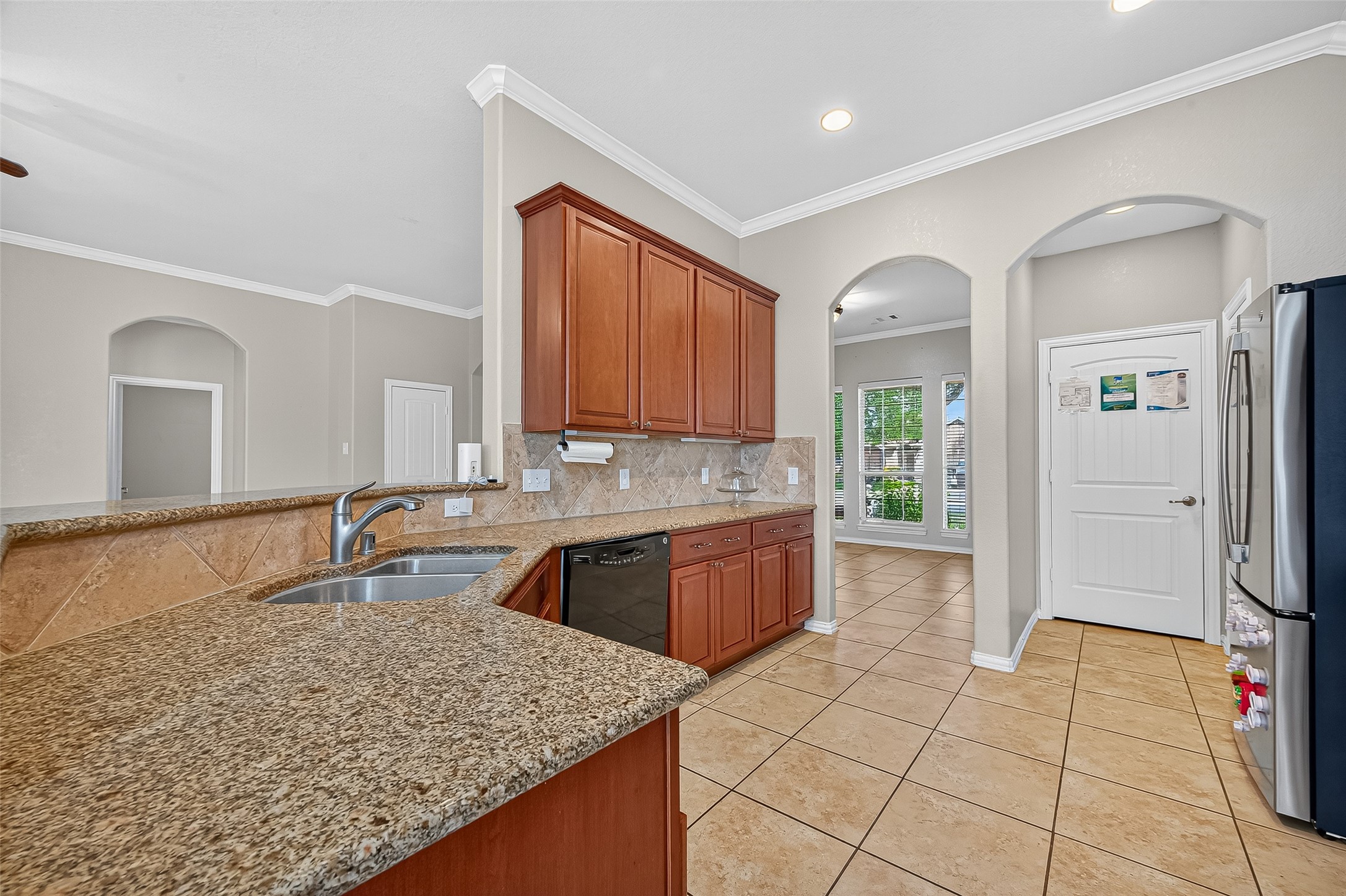 2019 Preston Park Rosenberg, TX 77471 - Photo 11 of 31 a large kitchen with kitchen island granite countertop a sink and cabinets