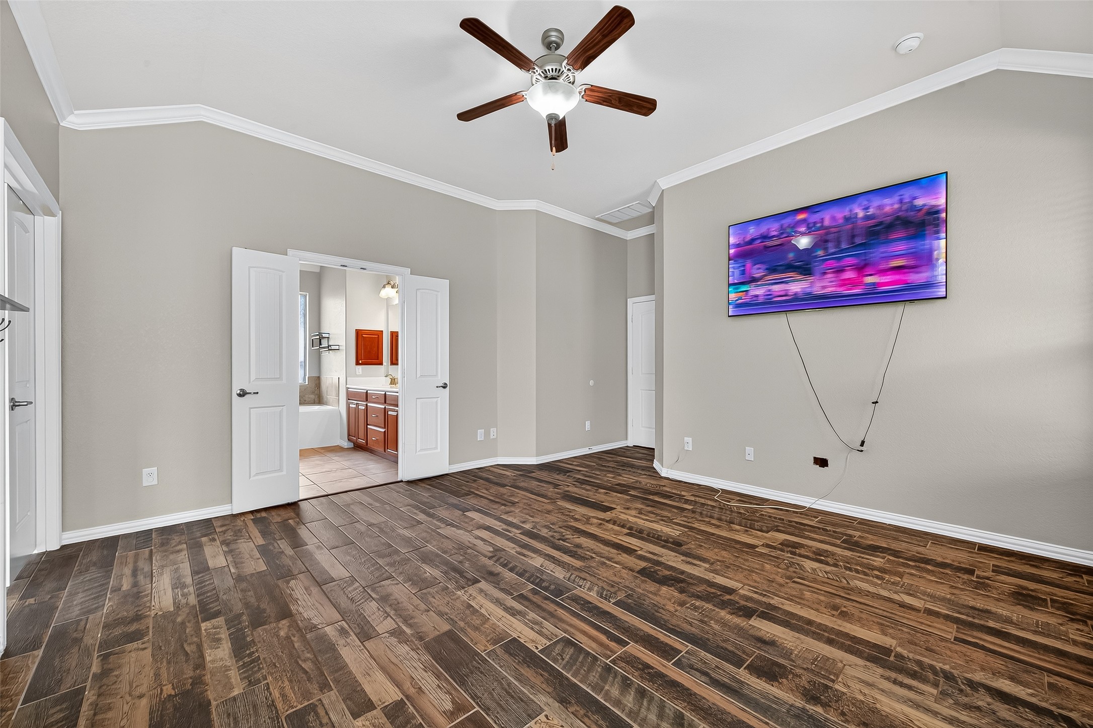 2019 Preston Park Rosenberg, TX 77471 - Photo 16 of 31 a view of a room with wooden floor and a ceiling fan