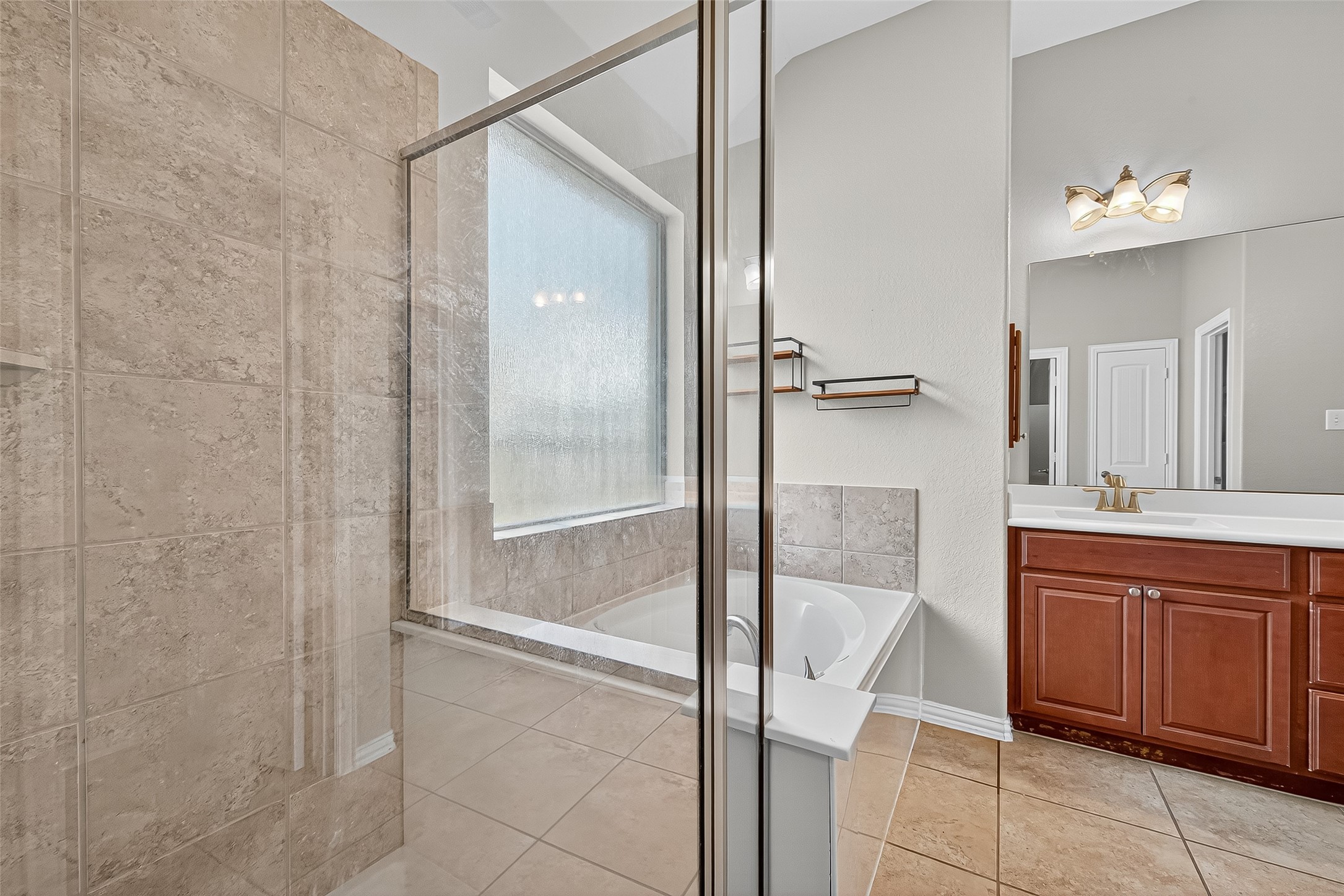 2019 Preston Park Rosenberg, TX 77471 - Photo 19 of 31 a bathroom with a shower and a sink