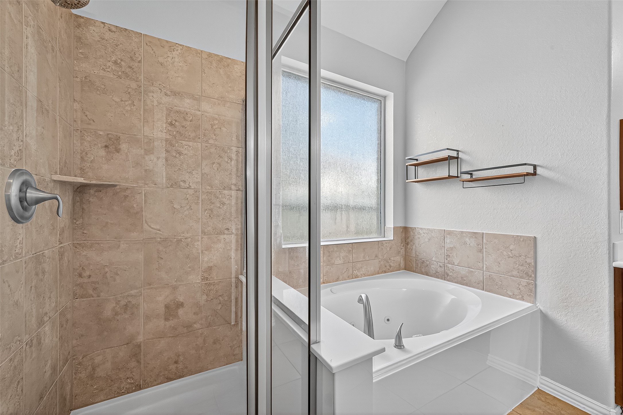 2019 Preston Park Rosenberg, TX 77471 - Photo 21 of 31 a bathroom with a tub and shower