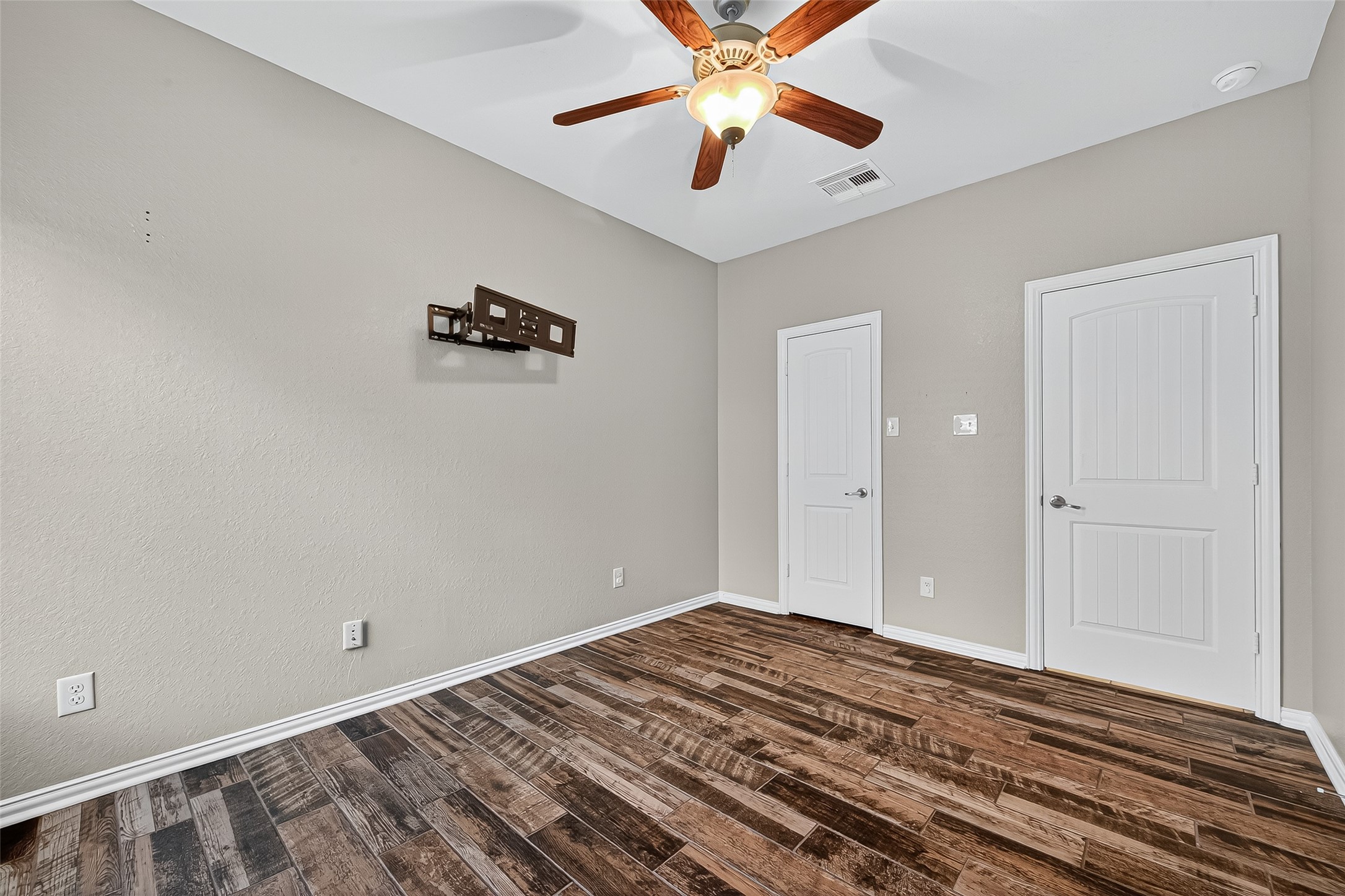 2019 Preston Park Rosenberg, TX 77471 - Photo 22 of 31 a view of a room that has a bed and a chandelier fan