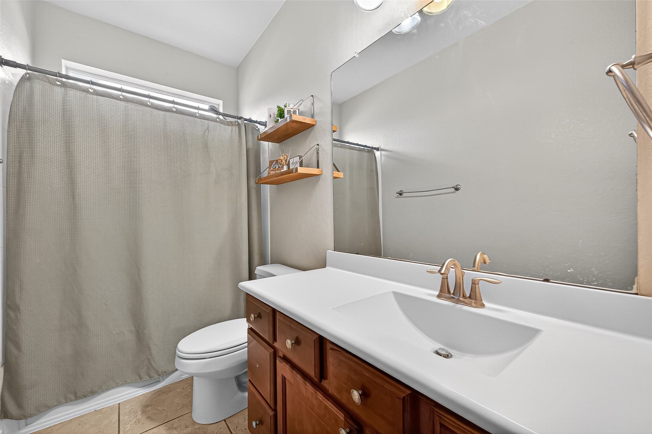 2019 Preston Park Rosenberg, TX 77471 - Photo 23 of 31 a bathroom with a sink and a mirror
