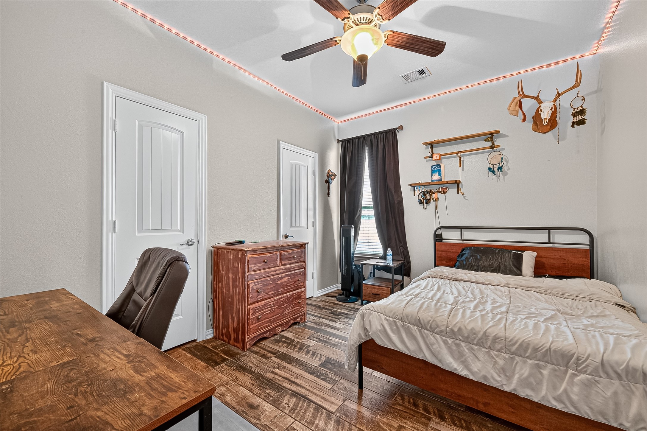 2019 Preston Park Rosenberg, TX 77471 - Photo 24 of 31 a bedroom with a bed and wooden floor