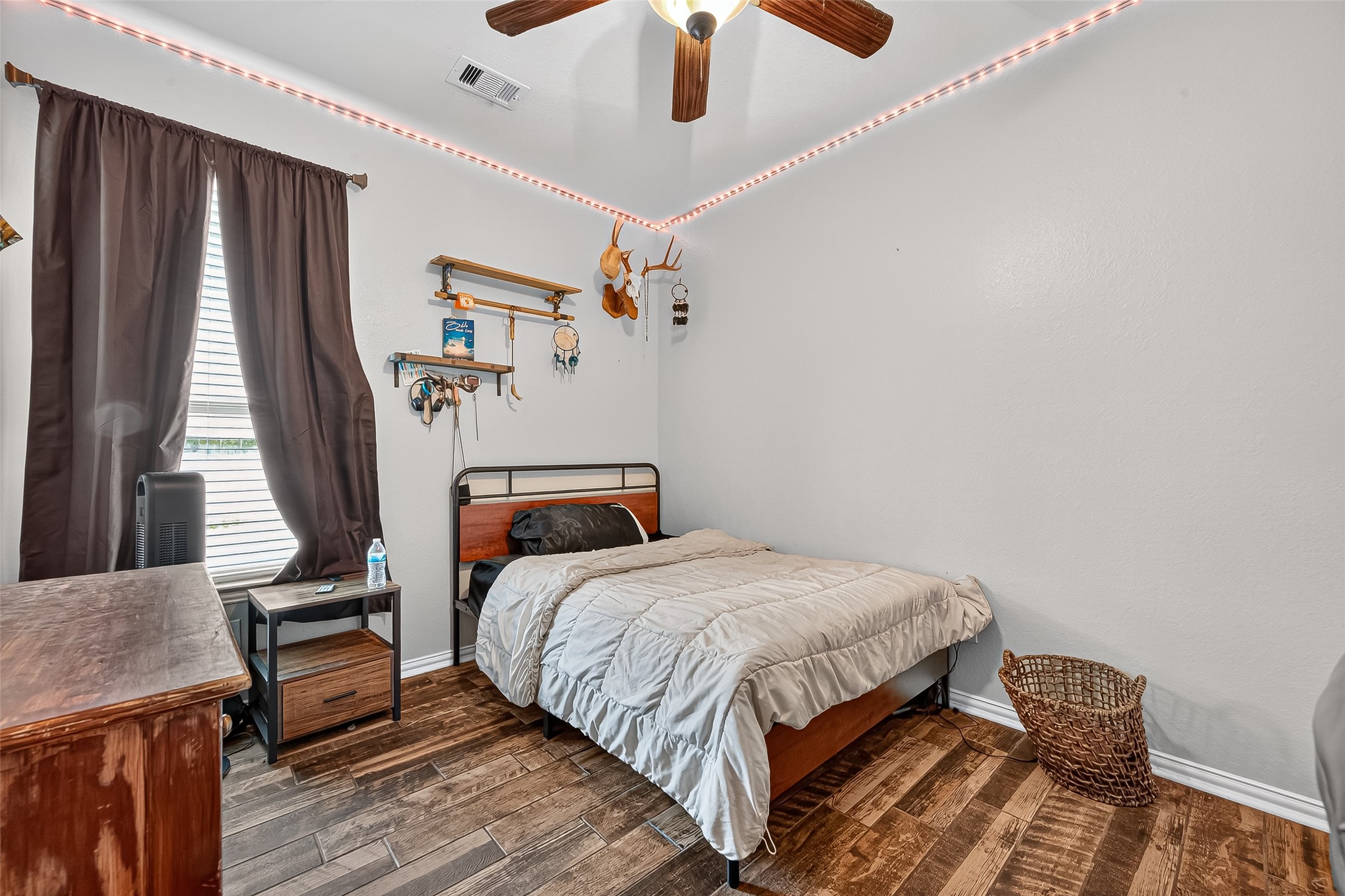 2019 Preston Park Rosenberg, TX 77471 - Photo 25 of 31 a bedroom with bed and wooden floor