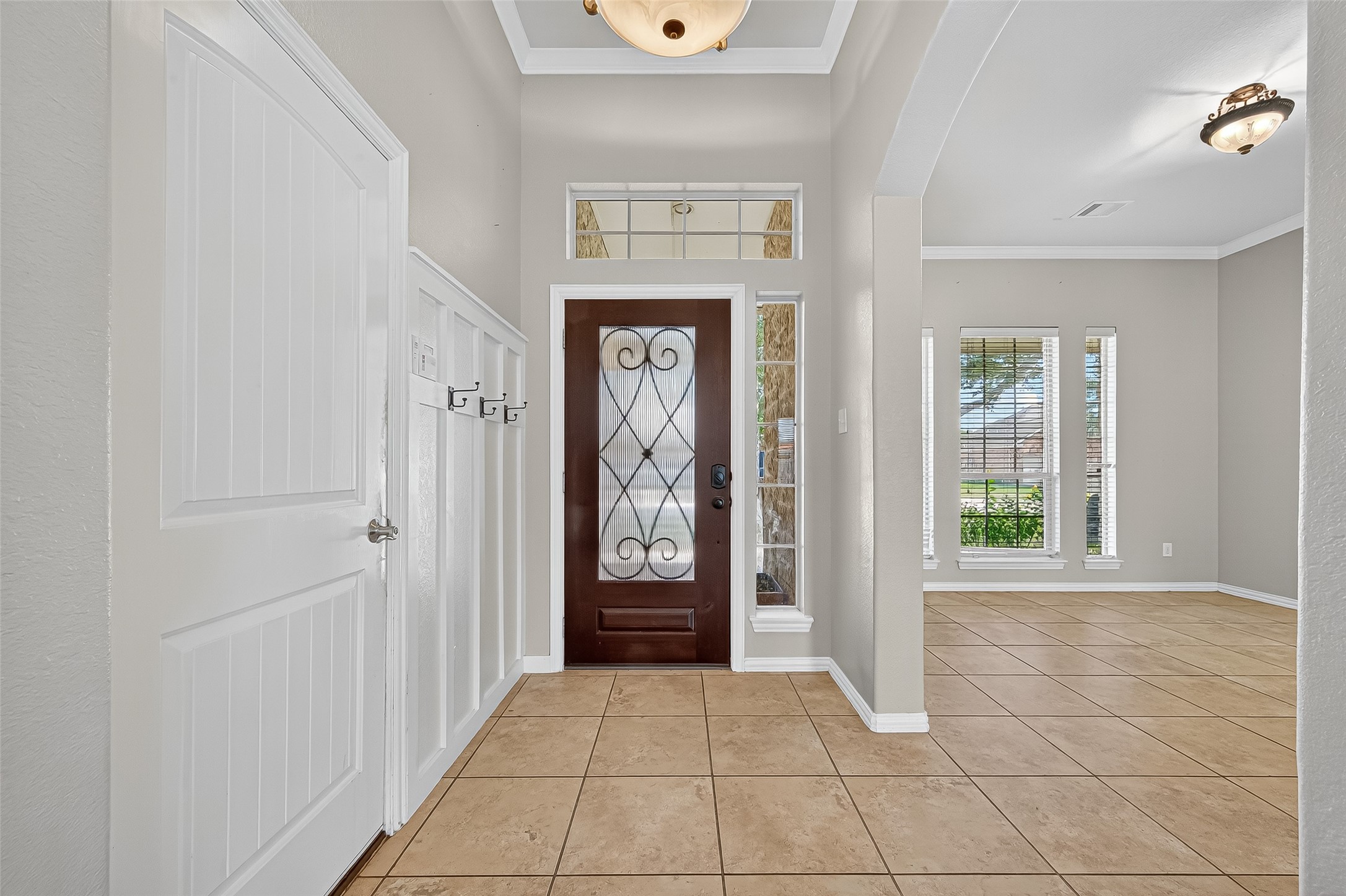2019 Preston Park Rosenberg, TX 77471 - Photo 5 of 31 a view of a hallway with wooden floor and windows