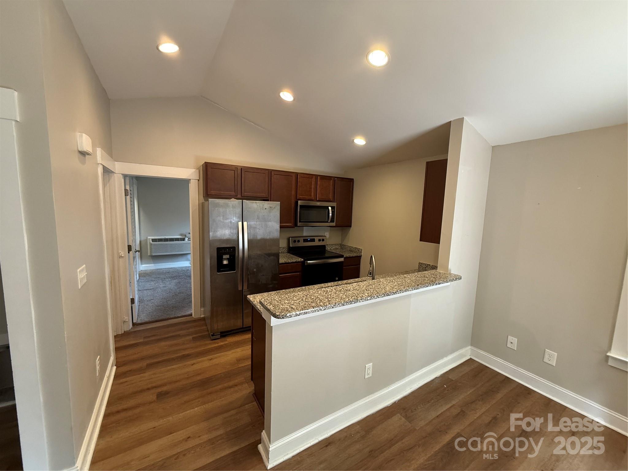 664 Reeves Court Charlotte, NC 28208 - Photo 4 of 9 a kitchen with a refrigerator and a sink