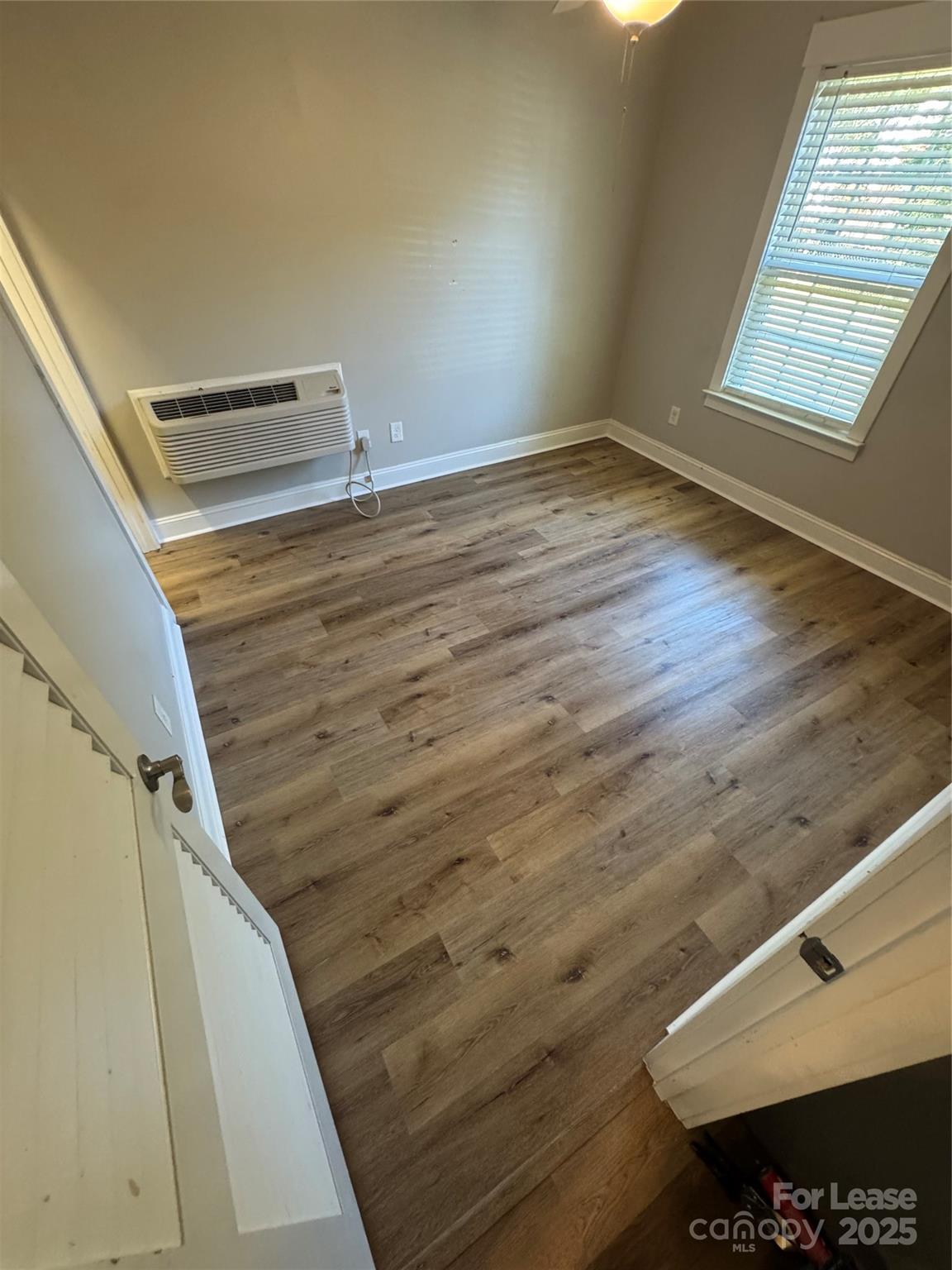 664 Reeves Court Charlotte, NC 28208 - Photo 8 of 9 a view of wooden floor and staircase