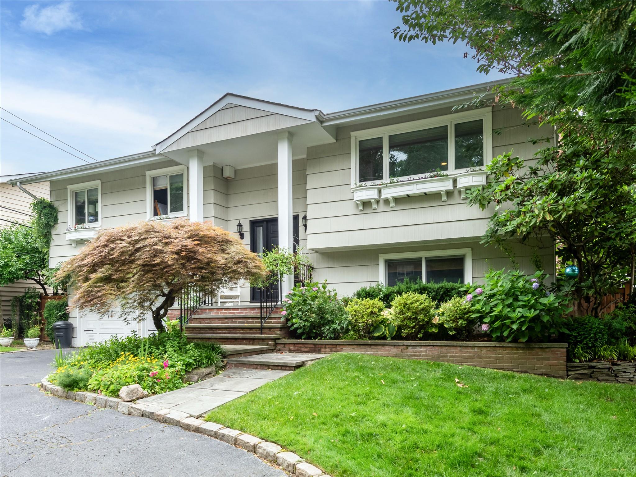 139 Cow Neck Road Port Washington, NY 11050 - Photo 1 of 1 Bi-level home with a front yard
