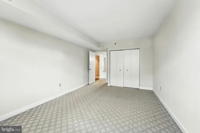a bathroom with a sink toilet vanity and shower