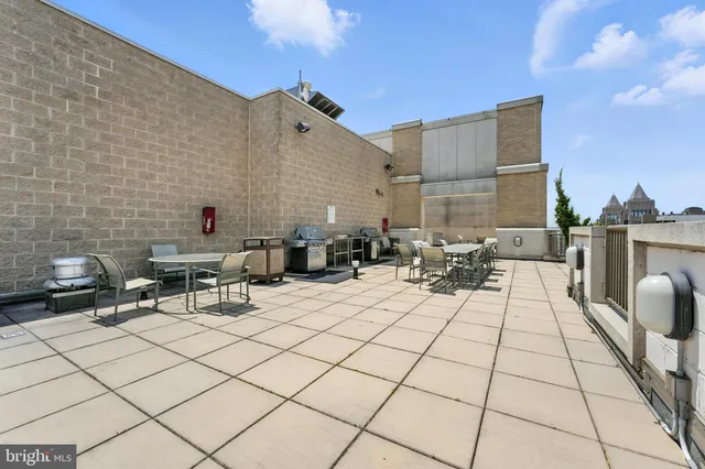 a view of a dinning table and chairs in the patio