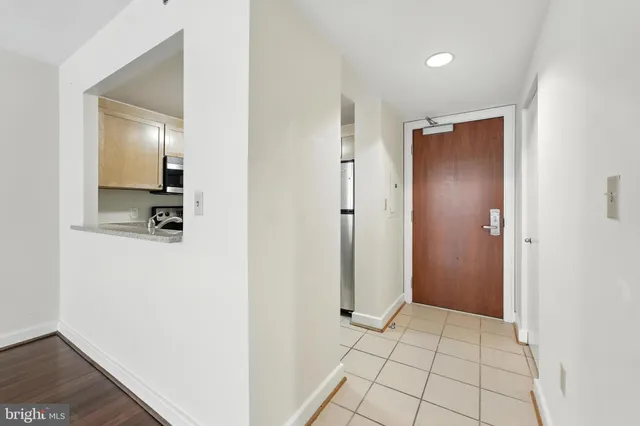 a walk in closet with a mirror