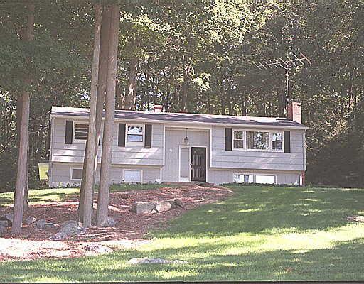 a view of a house with a yard