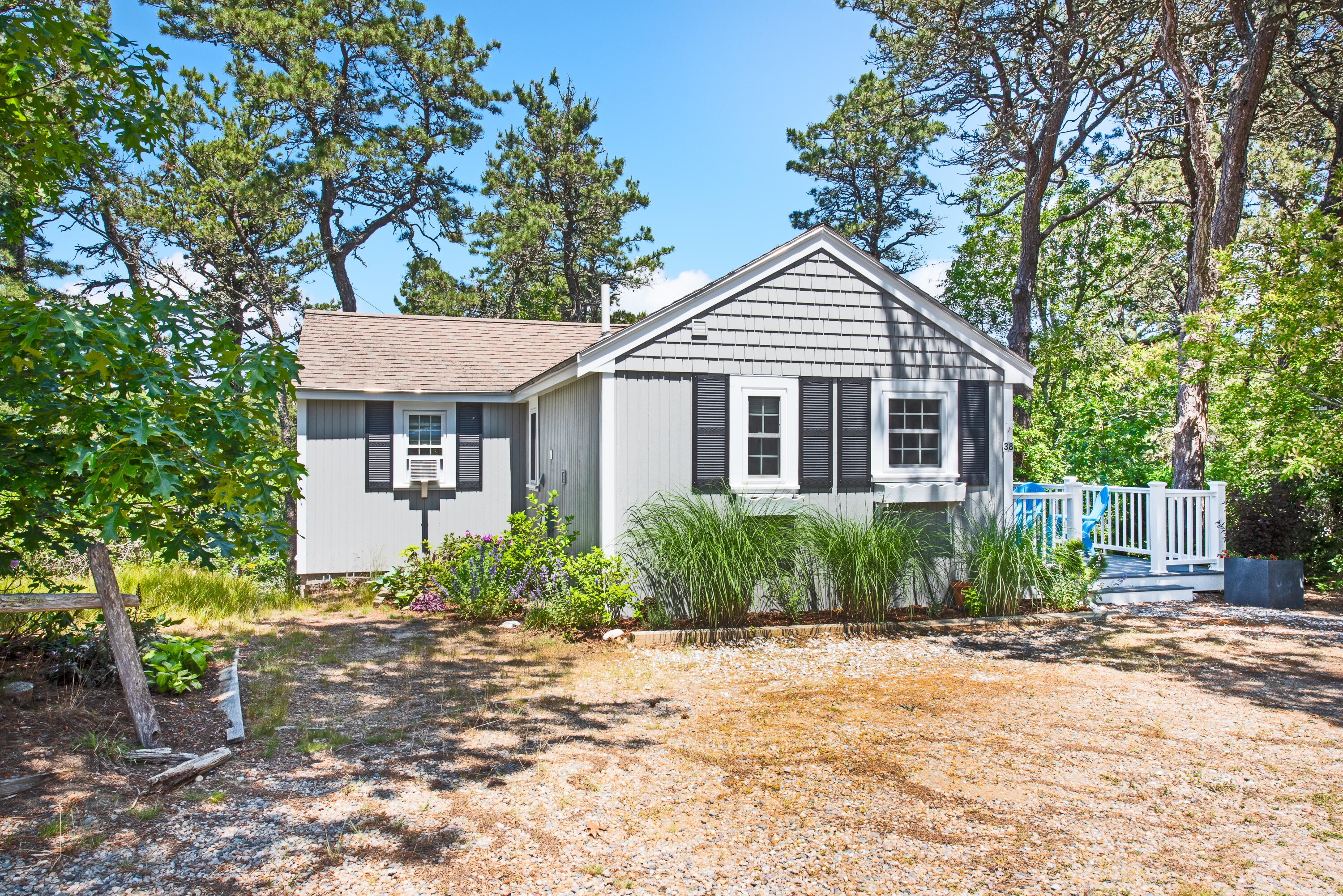 7 Great Hollow Road, Unit 38 Truro, MA 02666 - Photo 2 of 28 a front view of a house with garden
