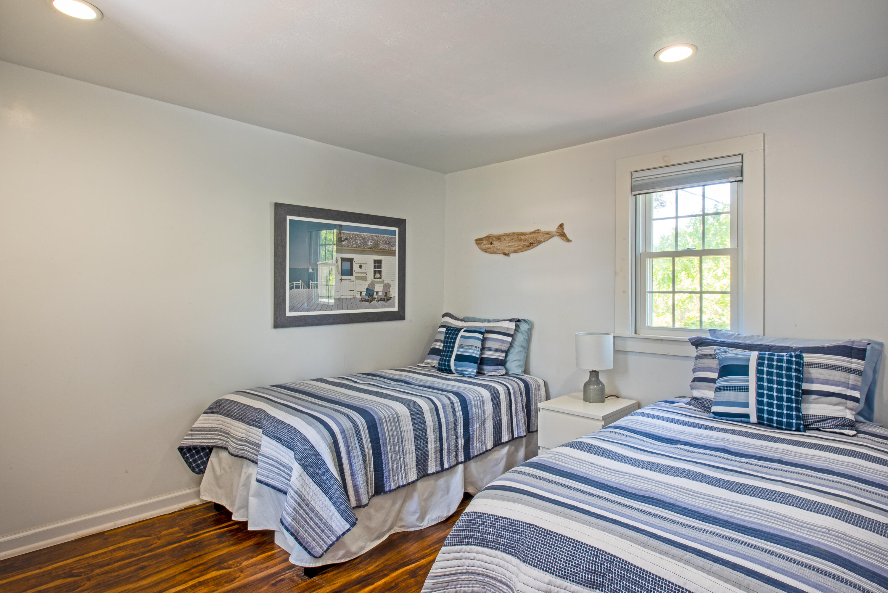 7 Great Hollow Road, Unit 38 Truro, MA 02666 - Photo 24 of 28 a bedroom with double bed and wooden floor