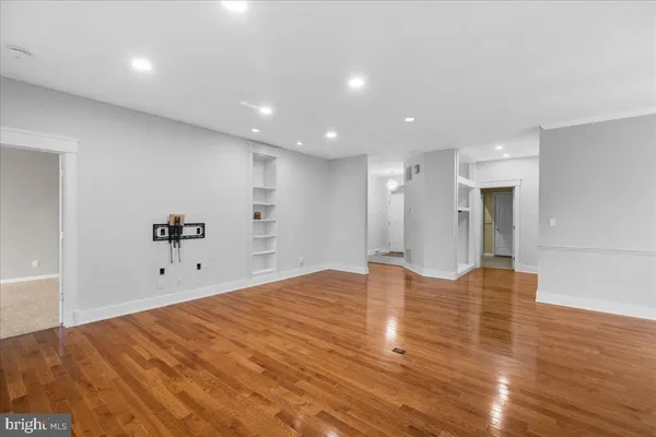 a kitchen with stainless steel appliances granite countertop a sink and a stove