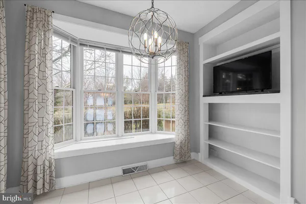 a kitchen with cabinets appliances and a counter space