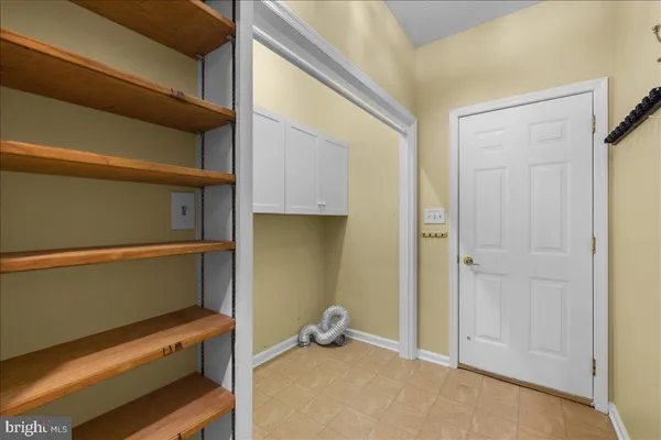 a kitchen with a sink cabinets and stainless steel appliances