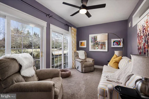 a view of walk in closet with clothes