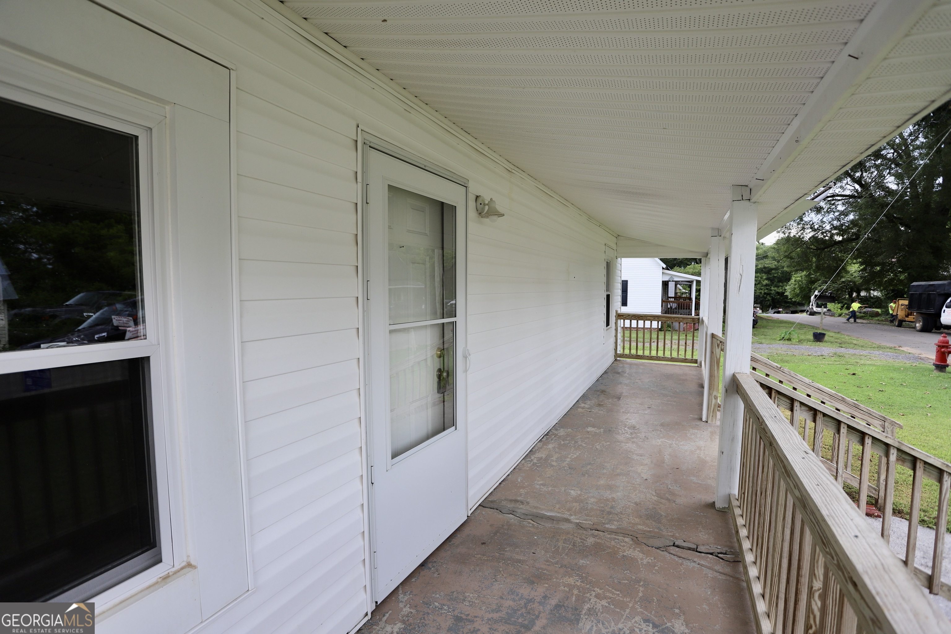 112 7th Street Trion, GA 30753 - Photo 12 of 28 a view of a porch with wooden floor and fence