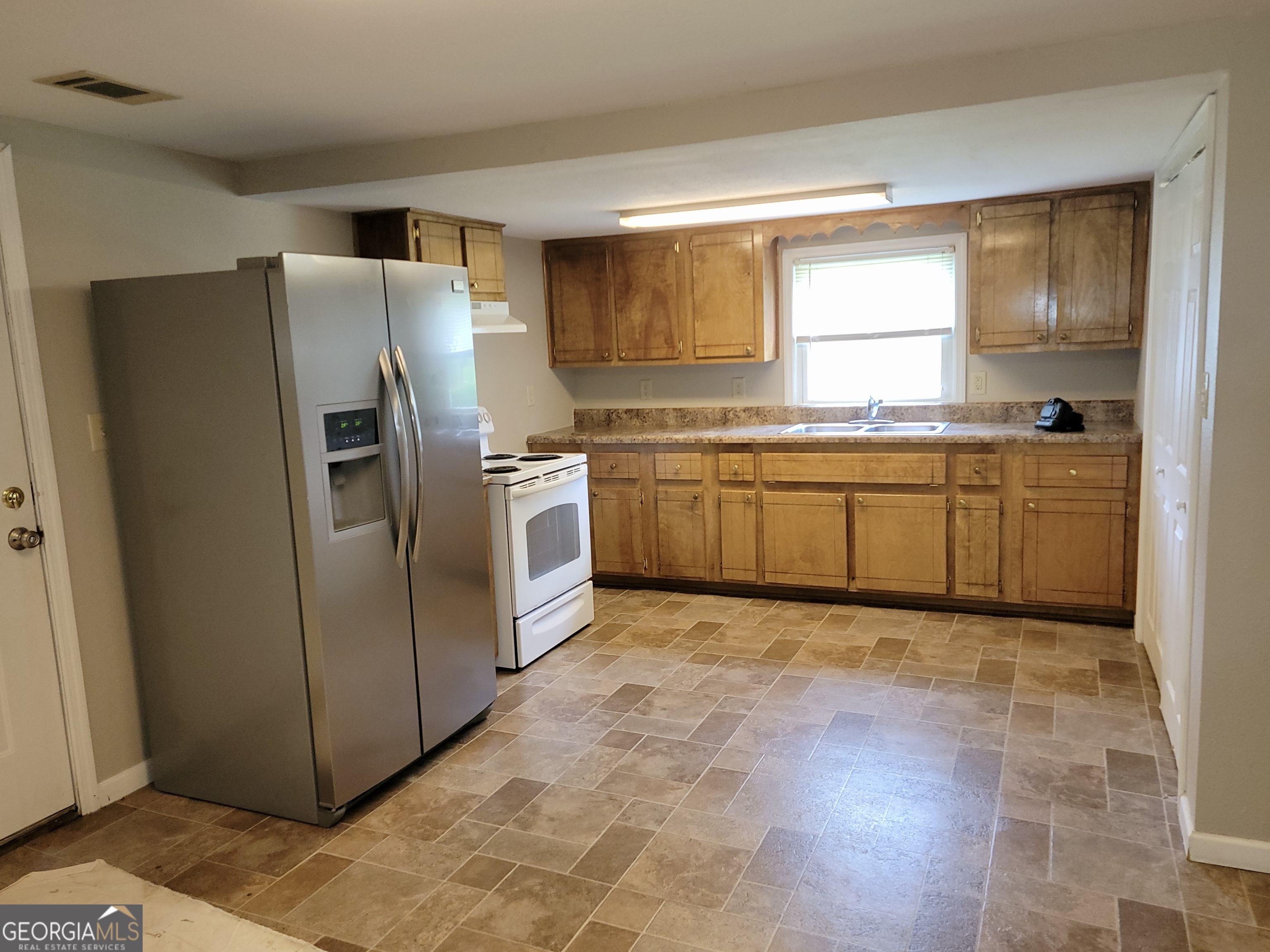 112 7th Street Trion, GA 30753 - Photo 17 of 28 a kitchen with stainless steel appliances granite countertop a refrigerator and a sink