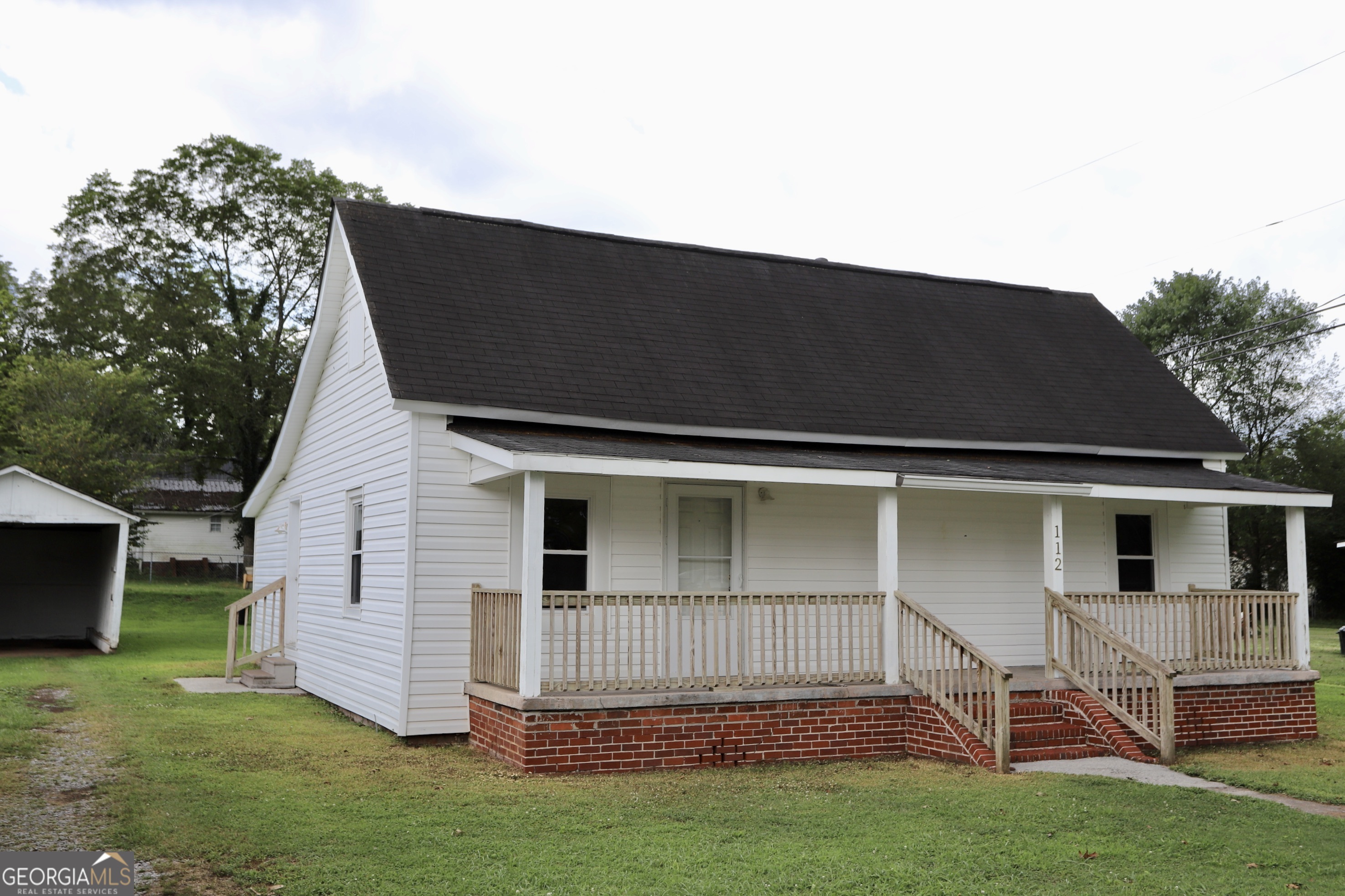 112 7th Street Trion, GA 30753 - Photo 2 of 28 a backyard of a house with table and chairs