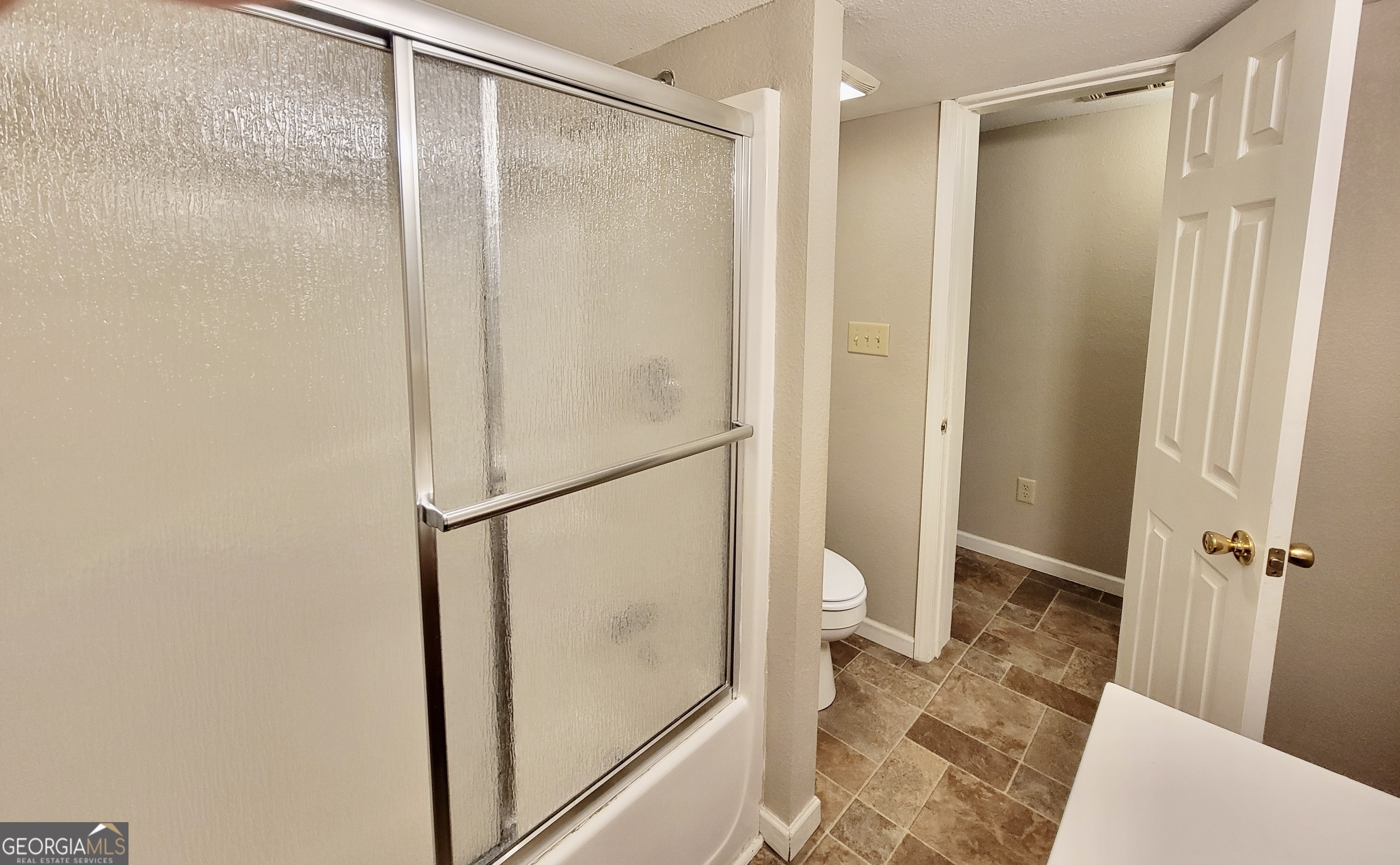 112 7th Street Trion, GA 30753 - Photo 22 of 28 a bathroom with a glass shower door