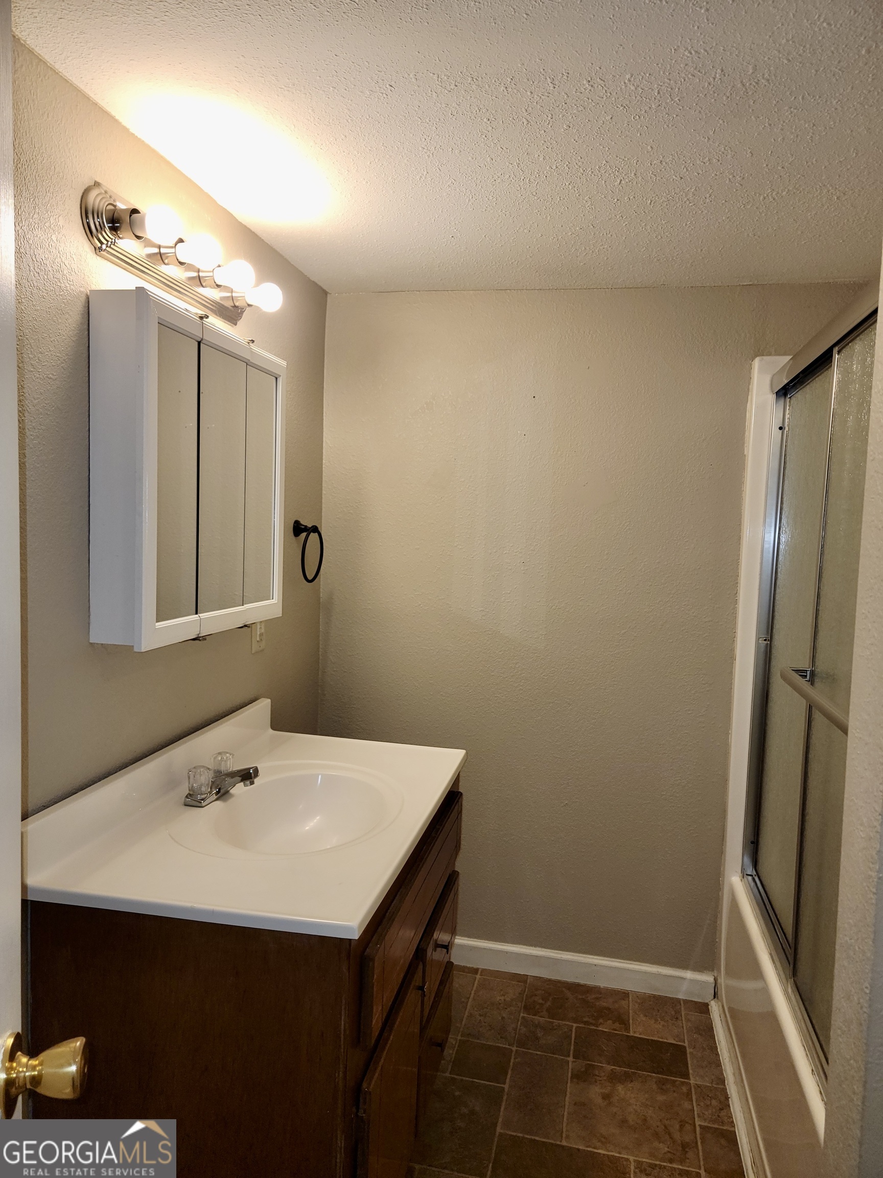112 7th Street Trion, GA 30753 - Photo 23 of 28 a bathroom with a sink and mirror