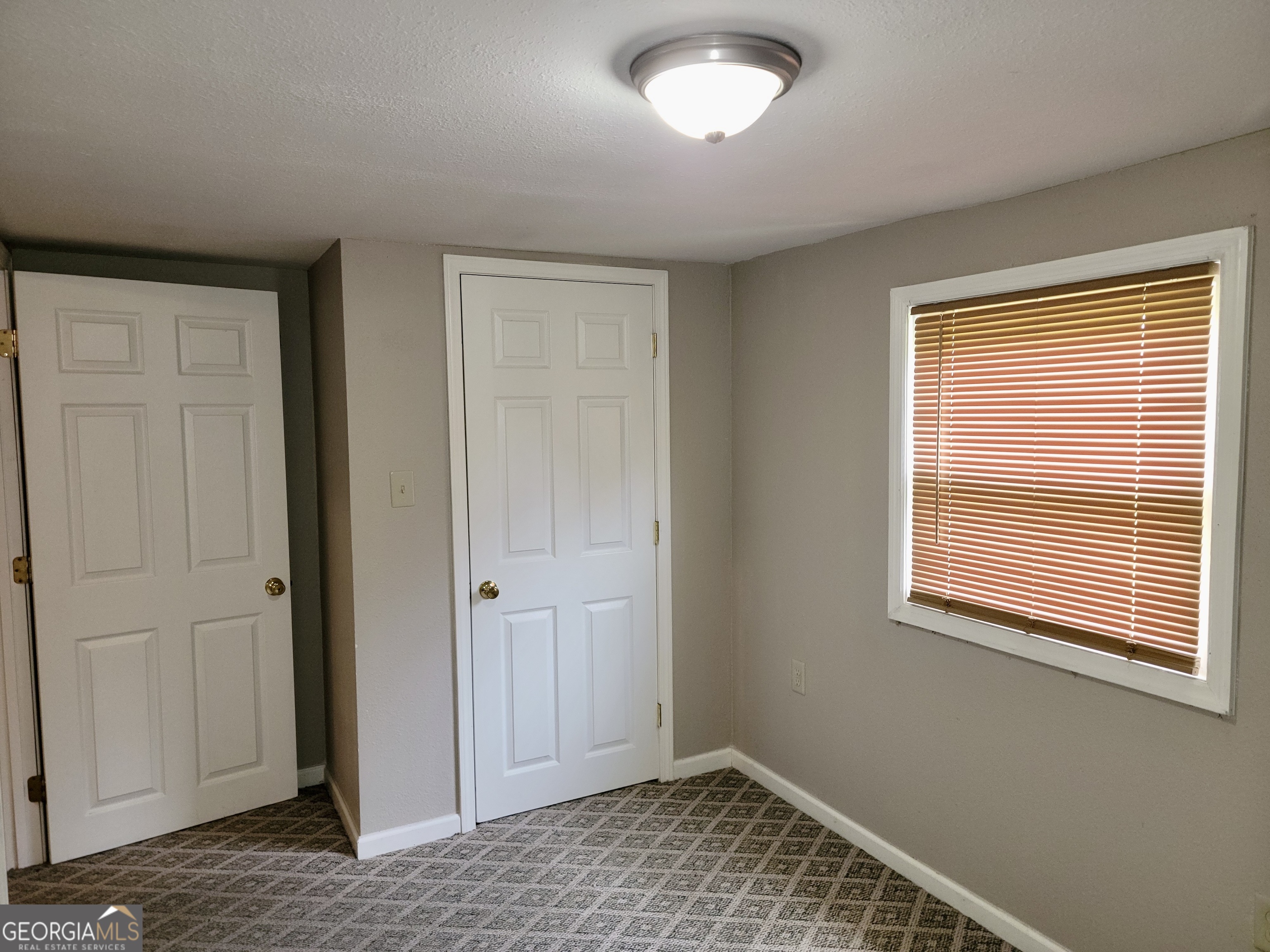 112 7th Street Trion, GA 30753 - Photo 25 of 28 a view of an empty room with window and wooden floor