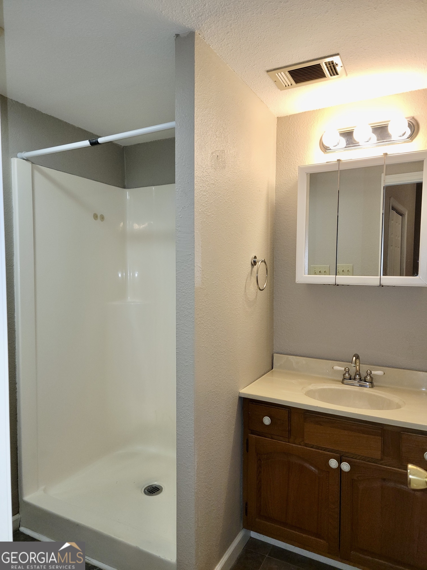 112 7th Street Trion, GA 30753 - Photo 26 of 28 a bathroom with a shower sink and mirror