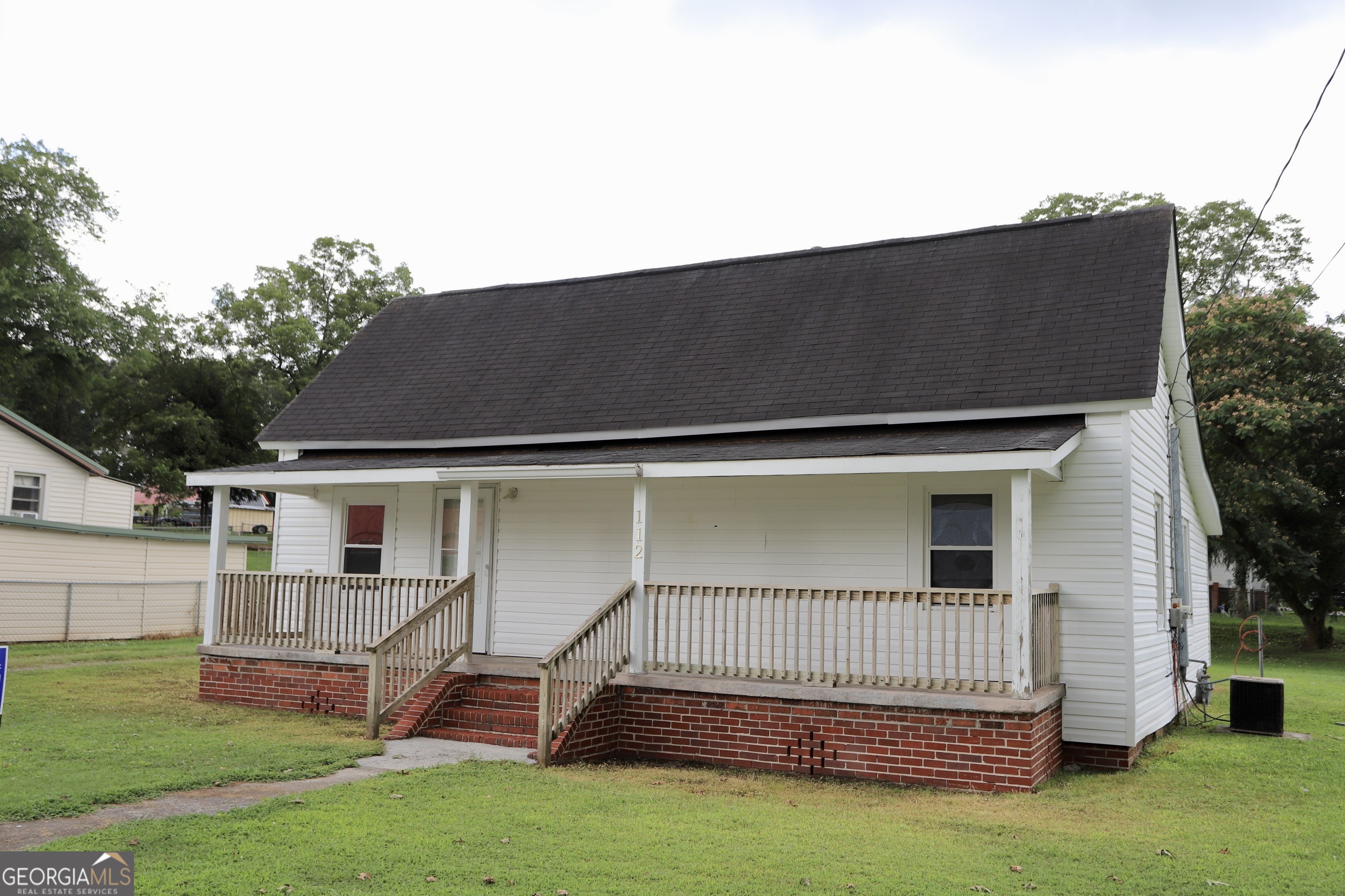 112 7th Street Trion, GA 30753 - Photo 4 of 28 a backyard of a house with table and chairs