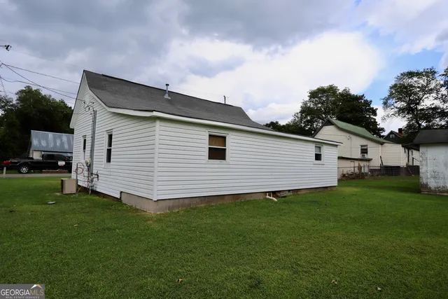 a view of a backyard of the house