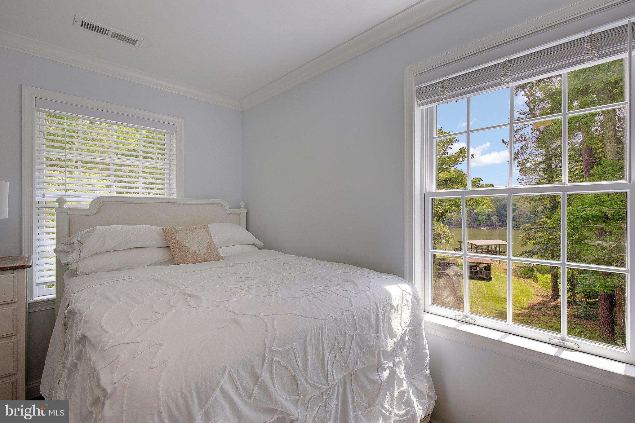 980 Apple Lane Solomons, MD 20629 - Photo 31 of 82 Serene bedroom with scenic views.