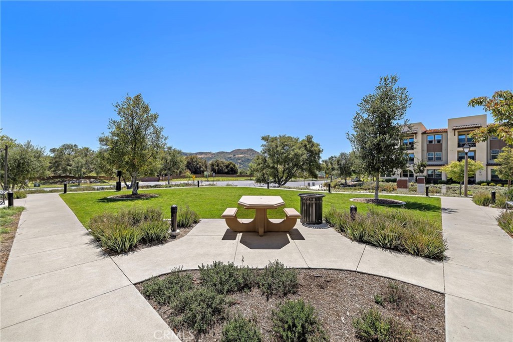 61 Wheelbarrow Road Rancho Mission Viejo, CA 92694 - Photo 45 of 74 a view of a swimming pool and a garden
