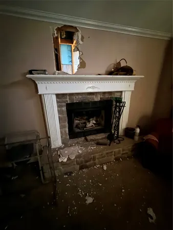 a fireplace with a vase on top of it