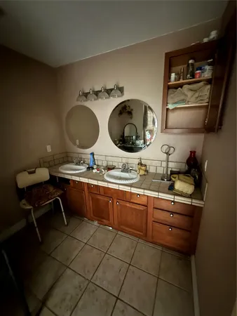 a kitchen with a sink and cabinets