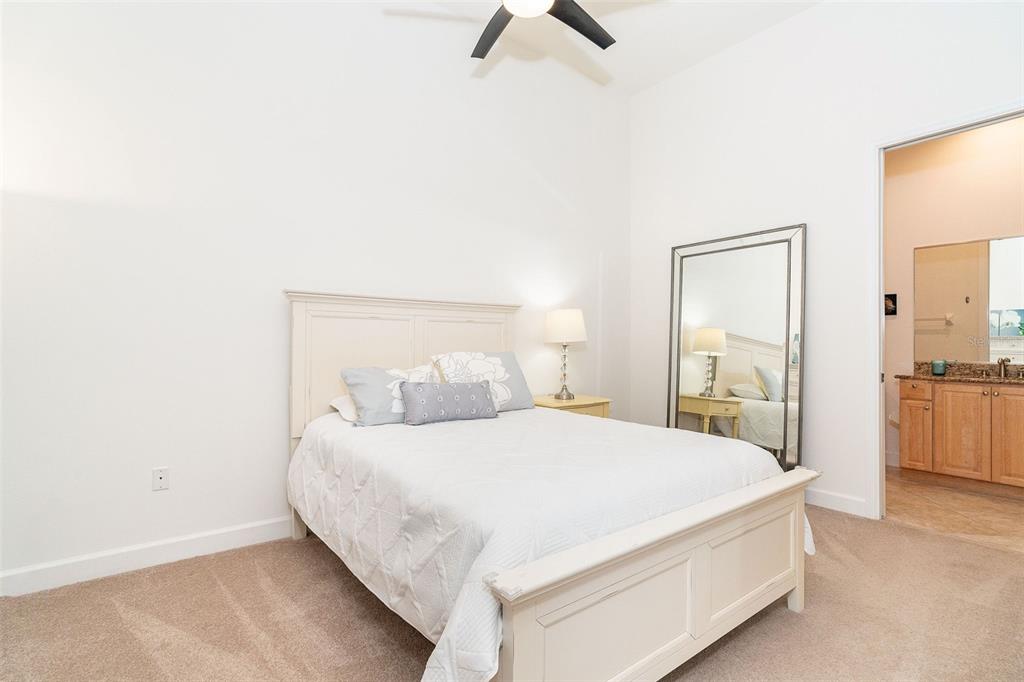 1375 Beach Road, Unit 309 Englewood, FL 34223 - Photo 11 of 45 a bedroom with a bed and a view of bathroom