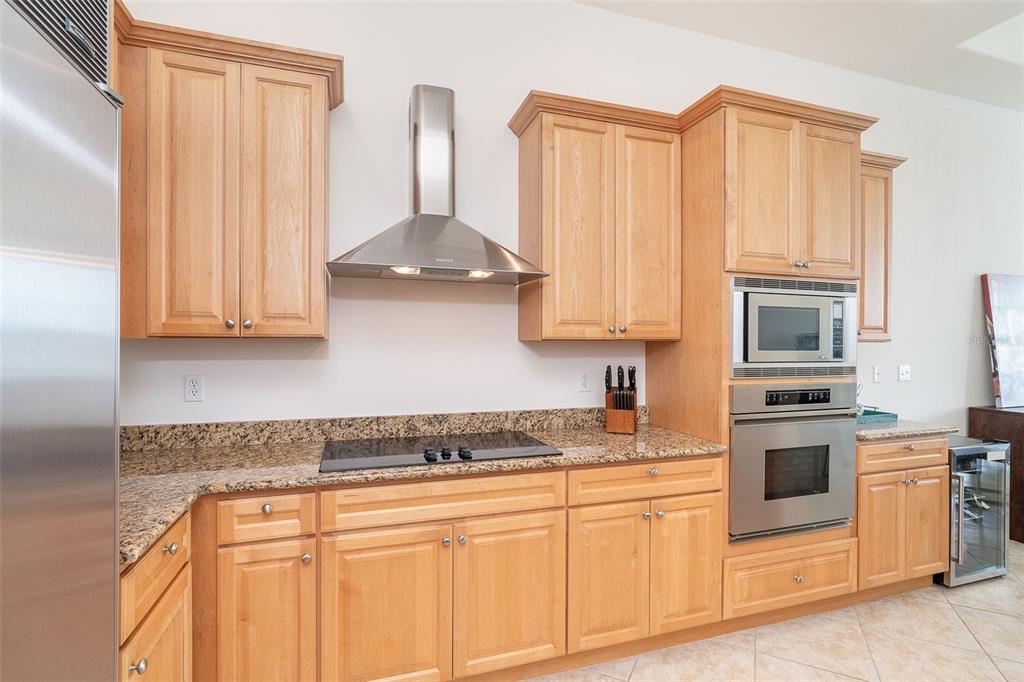 1375 Beach Road, Unit 309 Englewood, FL 34223 - Photo 18 of 45 a kitchen with stainless steel appliances granite countertop white cabinets and a sink
